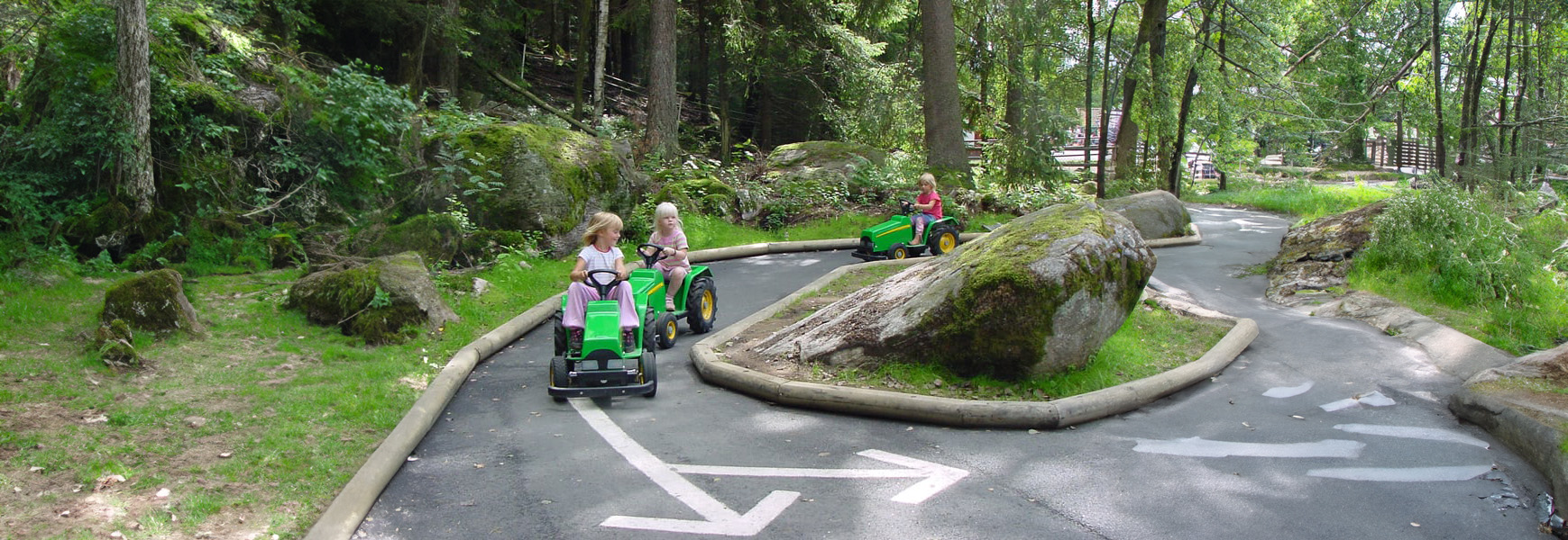 Tractors in the park for children, providing a fun and interactive experience for young visitors.