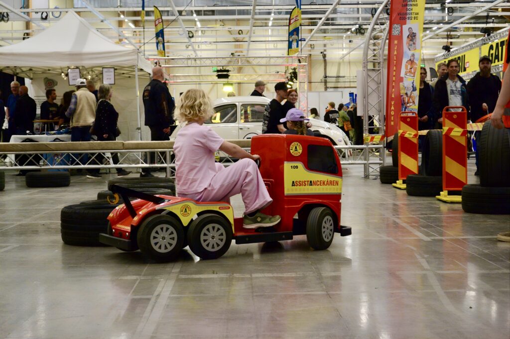a girl driving a mini truck